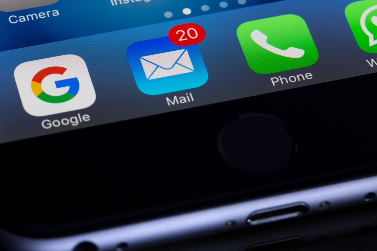 creative A close-up photo of a smartphone displaying popular apps like Google and Mail.